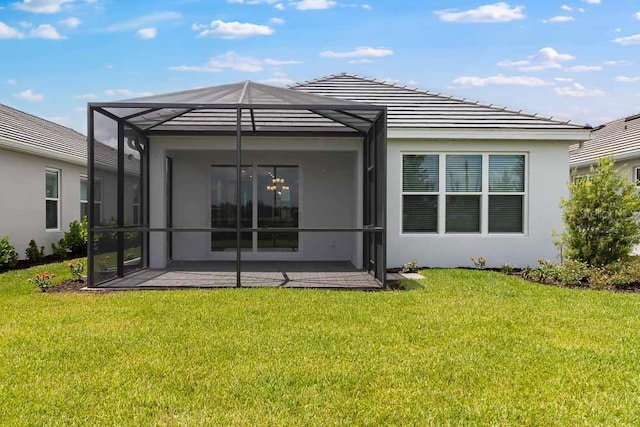 26930 Lark Ct, Punta Gorda, FL 33955 - rear view of house featuring a patio area, a yard, stucco siding, and a lanai