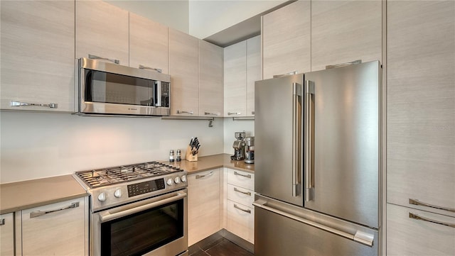 kitchen featuring stainless steel appliances and light countertops