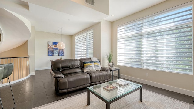 living area featuring visible vents and baseboards