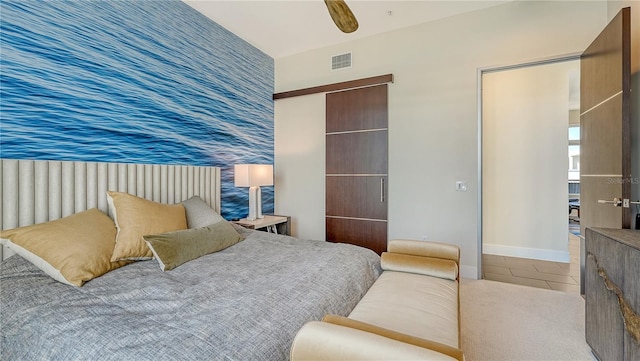 bedroom with wallpapered walls, baseboards, visible vents, an accent wall, and tile patterned floors