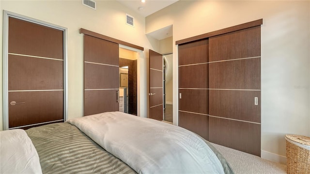 bedroom featuring a closet and visible vents