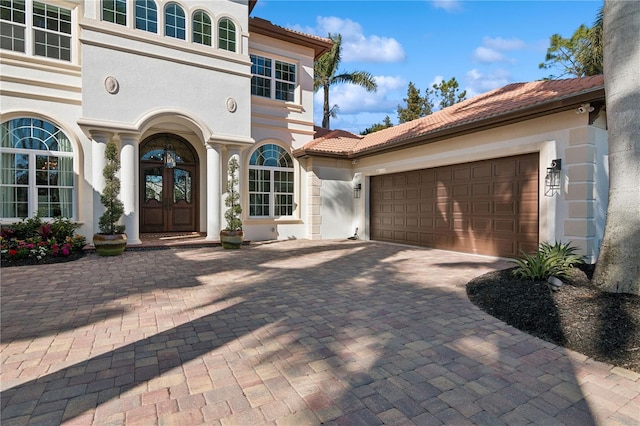 13315 Palmers Creek Ter, Lakewood Ranch, FL 34202 - doorway to property with a garage and french doors