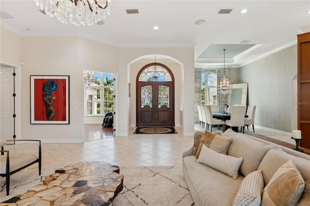 13315 Palmers Creek Ter, Lakewood Ranch, FL 34202 - tiled foyer entrance featuring an inviting chandelier and crown molding