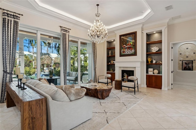 13315 Palmers Creek Ter, Lakewood Ranch, FL 34202 - tiled living room with an inviting chandelier, a tray ceiling, built in features, and crown molding