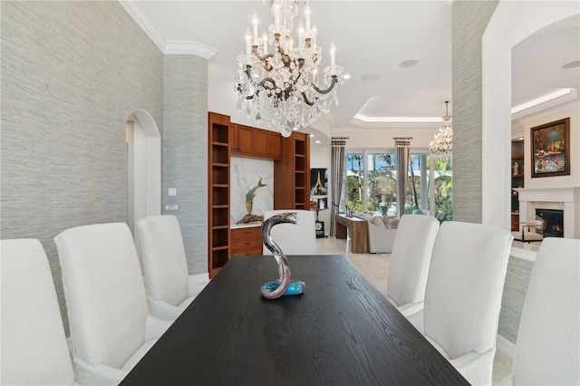 13315 Palmers Creek Ter, Lakewood Ranch, FL 34202 - dining room with a notable chandelier, crown molding, and a raised ceiling