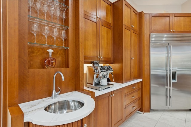 13315 Palmers Creek Ter, Lakewood Ranch, FL 34202 - kitchen featuring sink, stainless steel built in fridge, and light tile patterned flooring