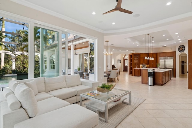 13315 Palmers Creek Ter, Lakewood Ranch, FL 34202 - living room featuring sink, crown molding, light tile patterned floors, a tray ceiling, and ceiling fan
