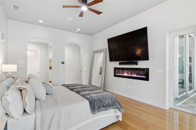 13315 Palmers Creek Ter, Lakewood Ranch, FL 34202 - bedroom with hardwood / wood-style flooring, access to outside, and ceiling fan
