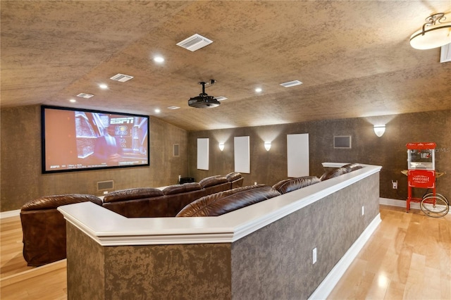 13315 Palmers Creek Ter, Lakewood Ranch, FL 34202 - cinema with lofted ceiling and light hardwood / wood-style floors