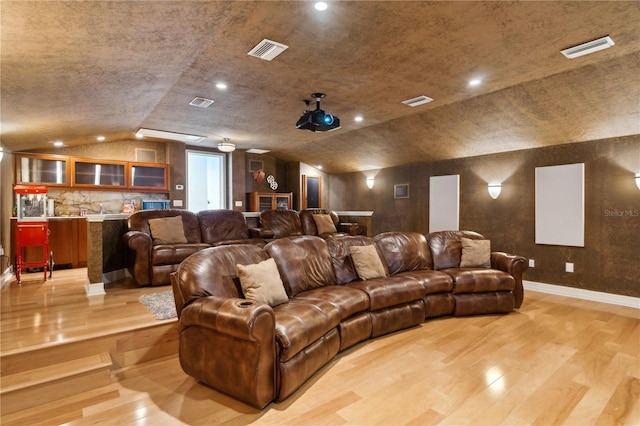 13315 Palmers Creek Ter, Lakewood Ranch, FL 34202 - cinema room with vaulted ceiling and light hardwood / wood-style flooring
