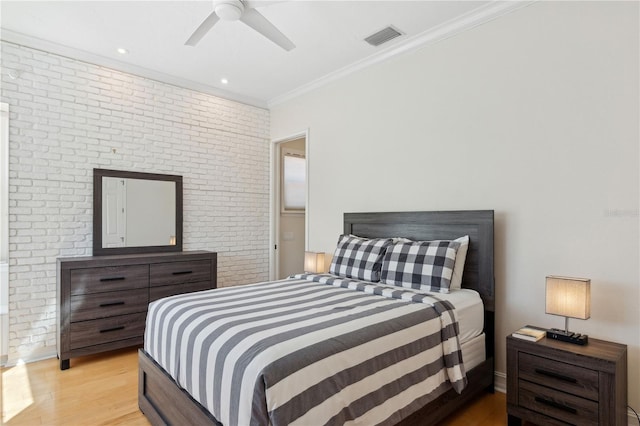 13315 Palmers Creek Ter, Lakewood Ranch, FL 34202 - bedroom featuring light hardwood / wood-style flooring, ornamental molding, ceiling fan, and brick wall