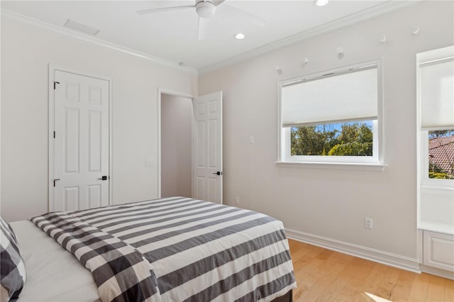13315 Palmers Creek Ter, Lakewood Ranch, FL 34202 - bedroom featuring ceiling fan, ornamental molding, and light hardwood / wood-style flooring