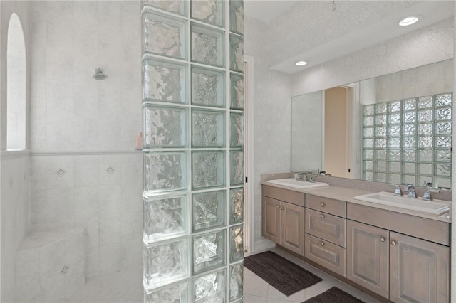 13315 Palmers Creek Ter, Lakewood Ranch, FL 34202 - bathroom featuring tile patterned floors, vanity, and a tile shower