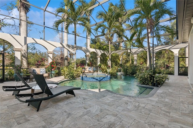 13315 Palmers Creek Ter, Lakewood Ranch, FL 34202 - view of swimming pool with an in ground hot tub, glass enclosure, and a patio