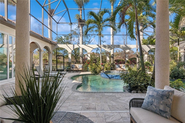 13315 Palmers Creek Ter, Lakewood Ranch, FL 34202 - view of pool with an in ground hot tub, outdoor lounge area, glass enclosure, and a patio area