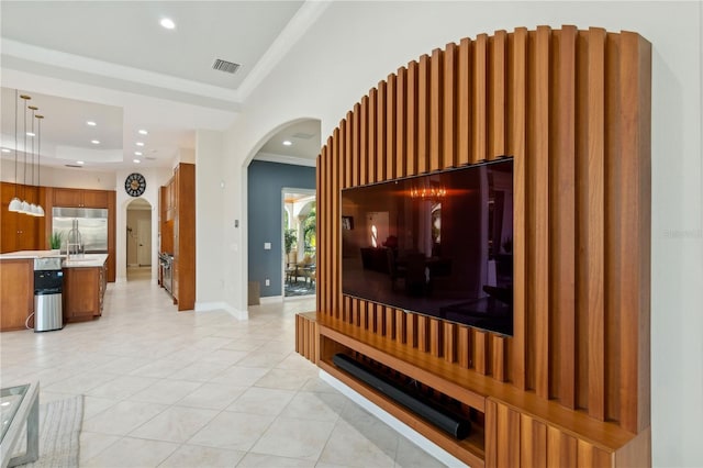13315 Palmers Creek Ter, Lakewood Ranch, FL 34202 - tiled living room featuring crown molding and a raised ceiling
