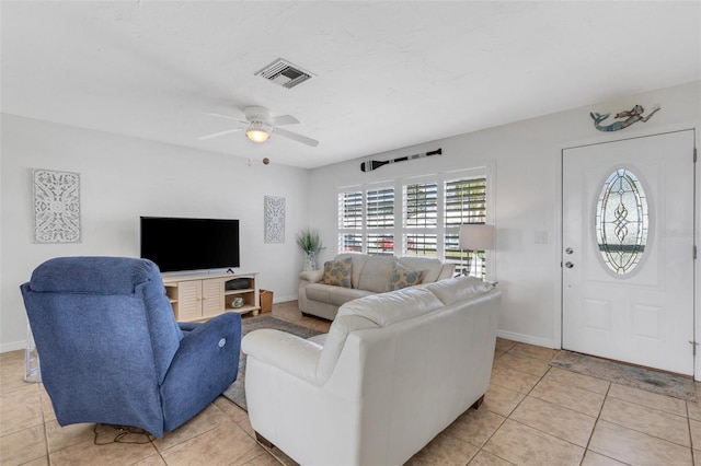 living room featuring ceiling fan and light tile patterned floors