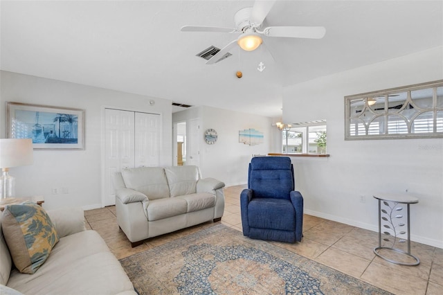 living room featuring light tile patterned floors and ceiling fan