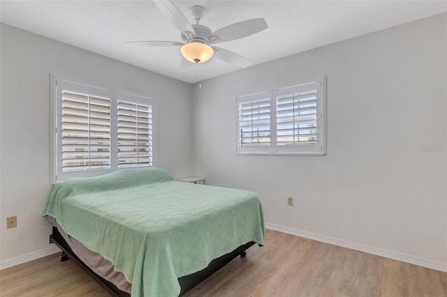 bedroom featuring light hardwood / wood-style floors and ceiling fan