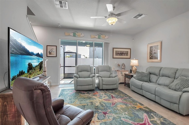 tiled living room featuring ceiling fan