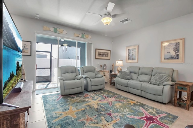 living room featuring ceiling fan and light tile patterned flooring