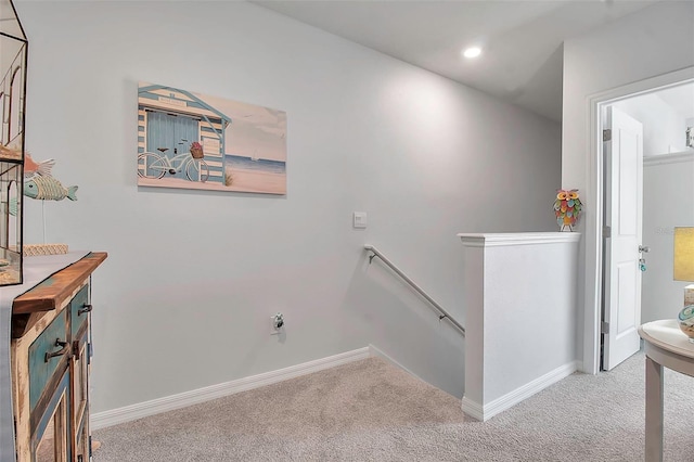 stairs featuring carpet floors