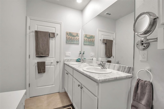 bathroom with vanity and tile patterned floors