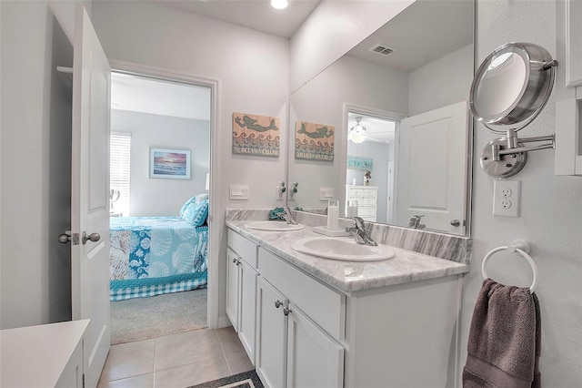 bathroom with vanity and tile patterned flooring