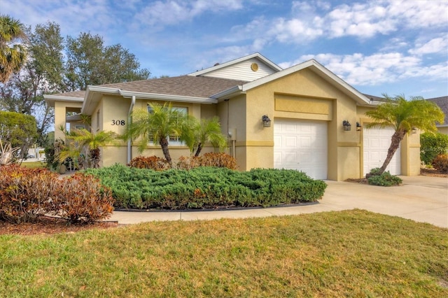 ranch-style house featuring a garage and a front lawn