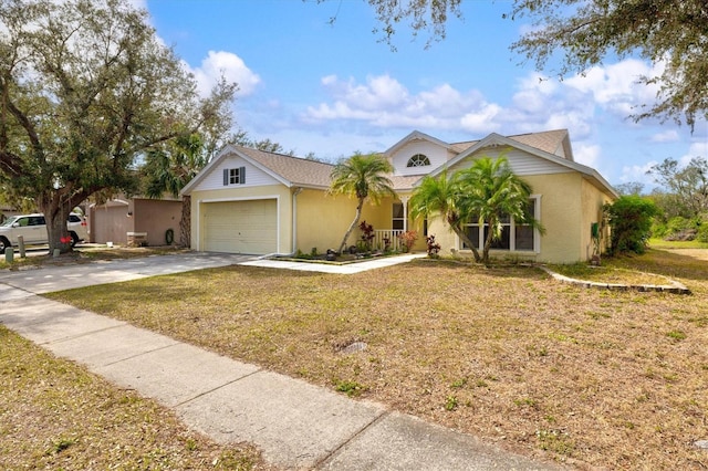 view of front of property with a garage and a front yard