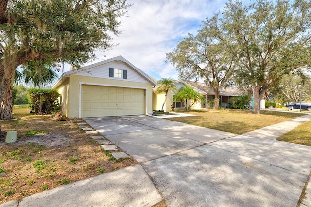 ranch-style home with a garage and a front lawn