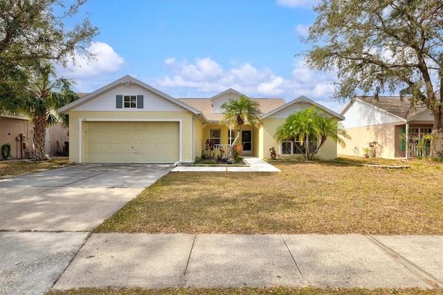 single story home featuring a garage and a front lawn