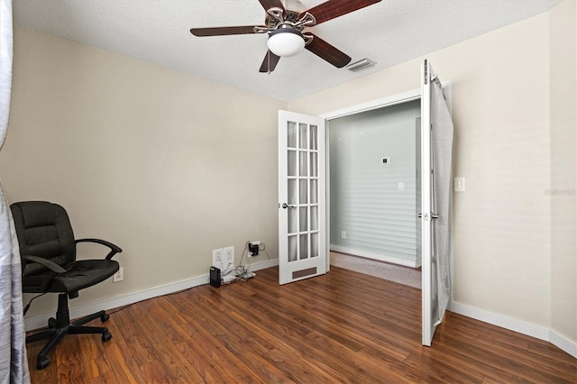 office area featuring french doors, ceiling fan, dark hardwood / wood-style floors, and a textured ceiling