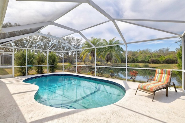 view of pool featuring a water view, a patio, and a lanai