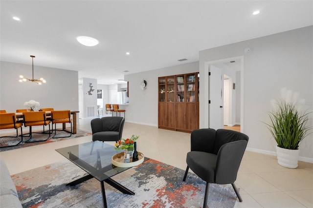 living area featuring visible vents, recessed lighting, an inviting chandelier, light tile patterned floors, and baseboards