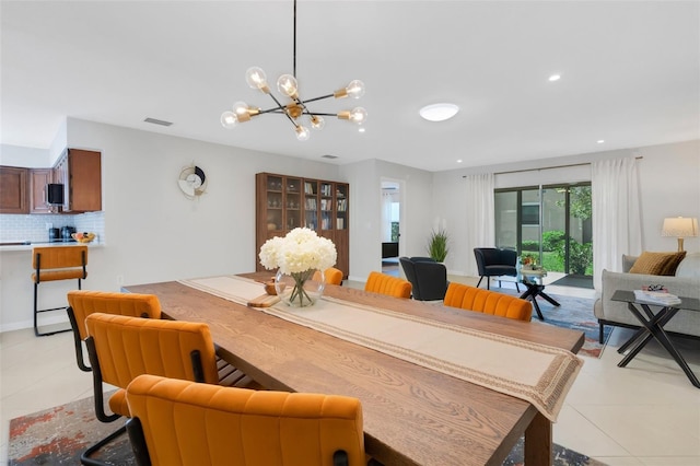 living area with an inviting chandelier, light tile patterned floors, recessed lighting, and visible vents