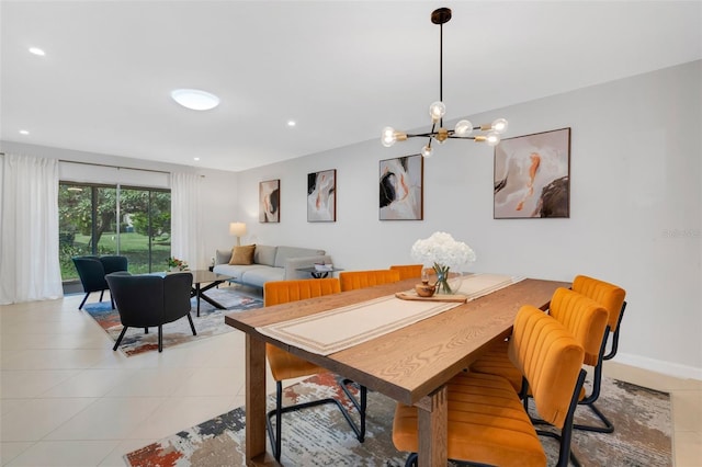 dining area with light tile patterned floors, baseboards, an inviting chandelier, and recessed lighting