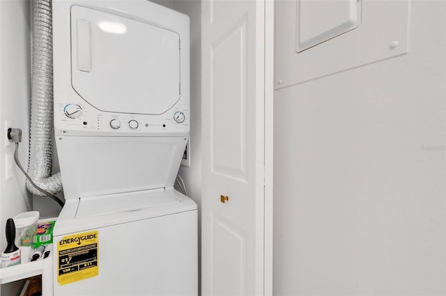 laundry area featuring stacked washer and dryer and laundry area