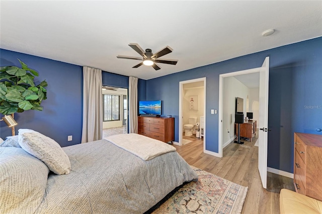 bedroom with ceiling fan, wood finished floors, connected bathroom, and baseboards