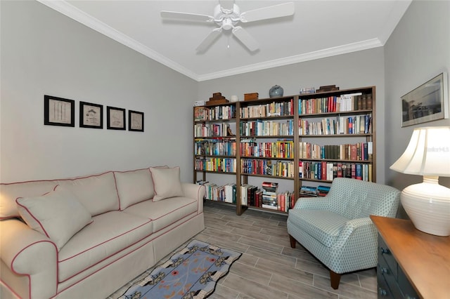living area featuring crown molding and ceiling fan