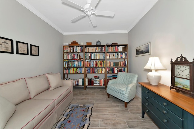living area with ornamental molding and ceiling fan
