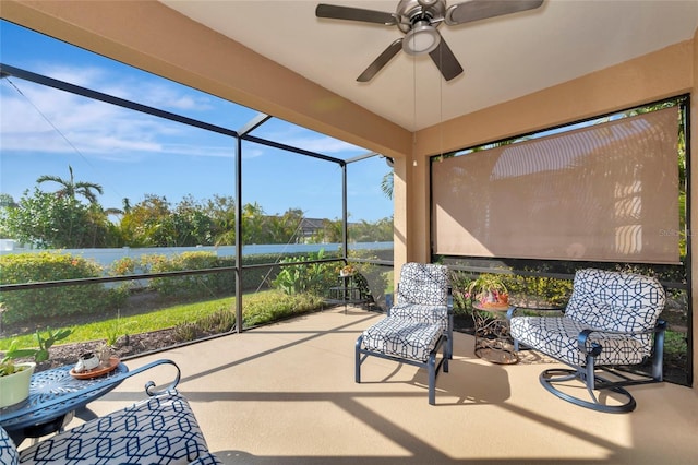 sunroom / solarium featuring ceiling fan