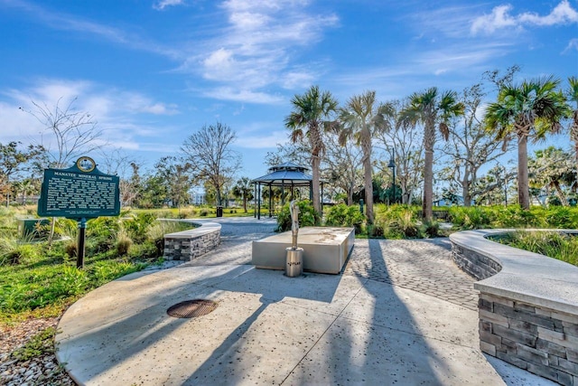 view of property's community with a patio and a gazebo