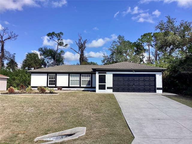 single story home featuring a garage and a front yard