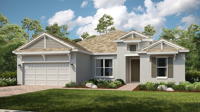 view of front of house with a garage and a front lawn