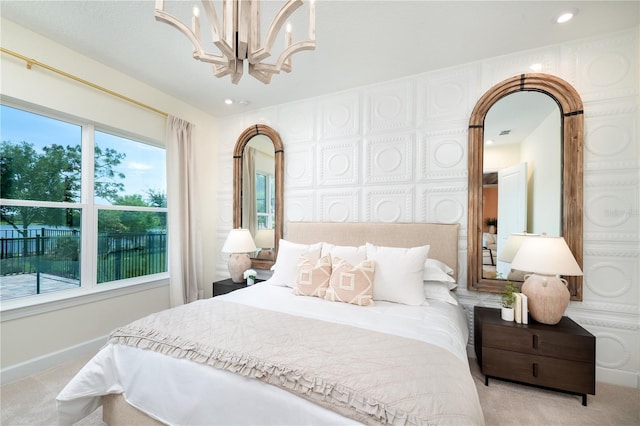 carpeted bedroom with an inviting chandelier