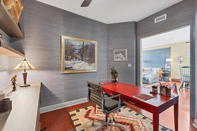 home office featuring ceiling fan and dark hardwood / wood-style flooring