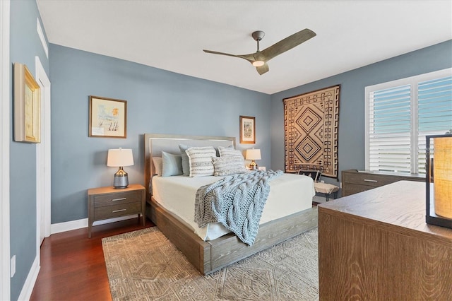 bedroom featuring ceiling fan and dark hardwood / wood-style floors