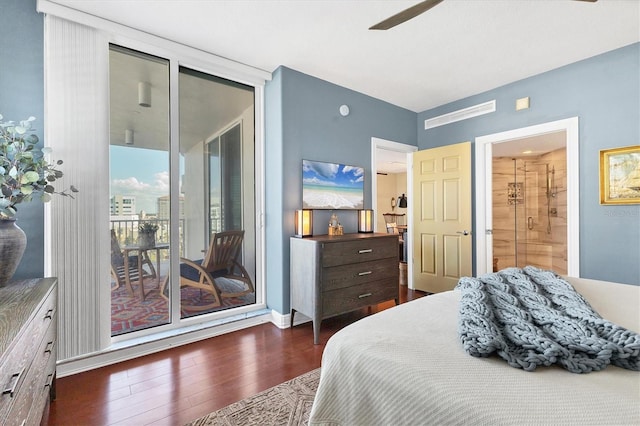 bedroom with floor to ceiling windows, dark wood-type flooring, access to outside, and ensuite bathroom