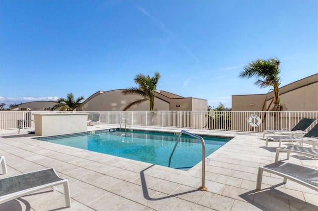 view of swimming pool with a patio area